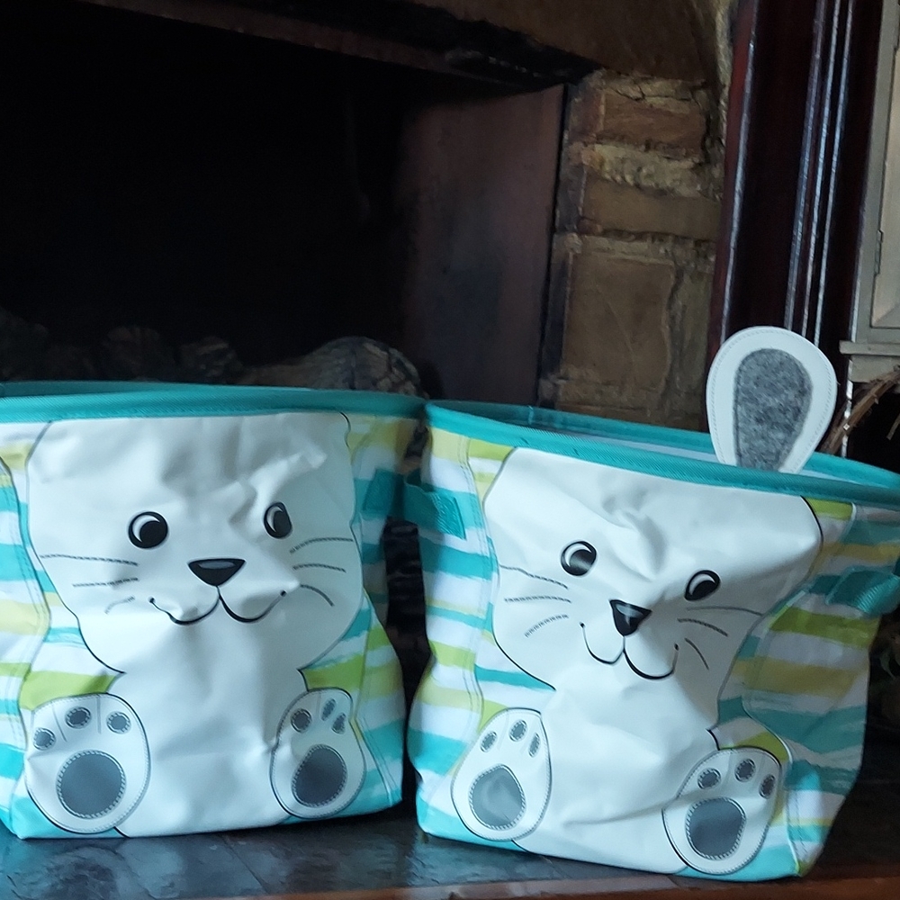 2 bunny thirty one storage bins both have intact ears. Cute for baby gift